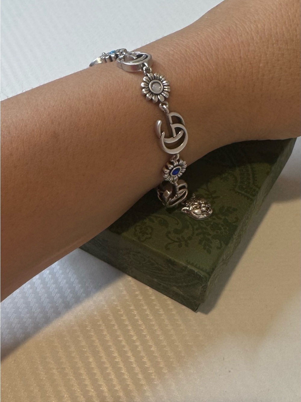 Gucci Silver Floral Logo Charm Bracelet with Blue Accents